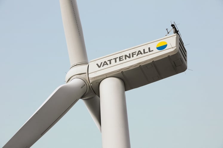 Close-up of Vattenfall wind turbine against a blue sky.